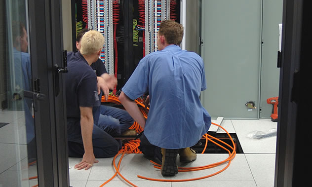 Data Center Professionals Working on a Server Rack